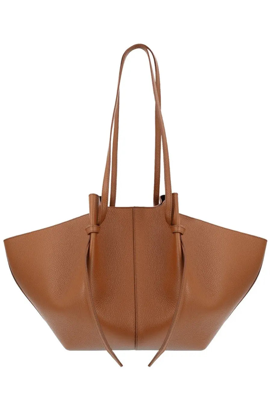 Tan leather tote bag with structured slightly flared silhouette and dual top handles tied at front by yuzefi