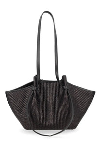 Black woven raffia tote bag with leather handles and drawstring closure from yuzefi womens raffia mochi bag black collection