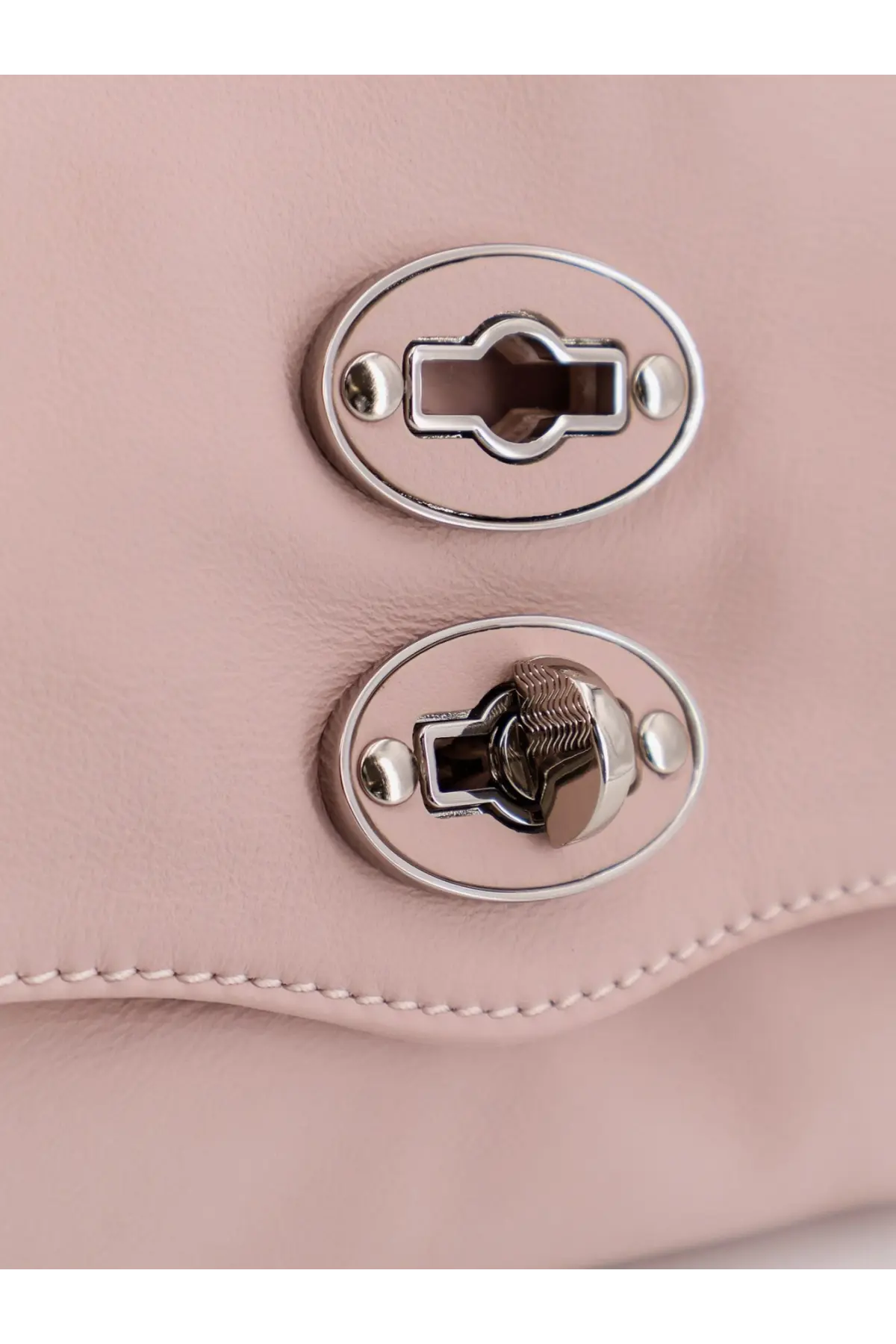 Pink leather zanellato women’s postina baby crossbody bag with silver oval clasps and textured metal lock mechanism