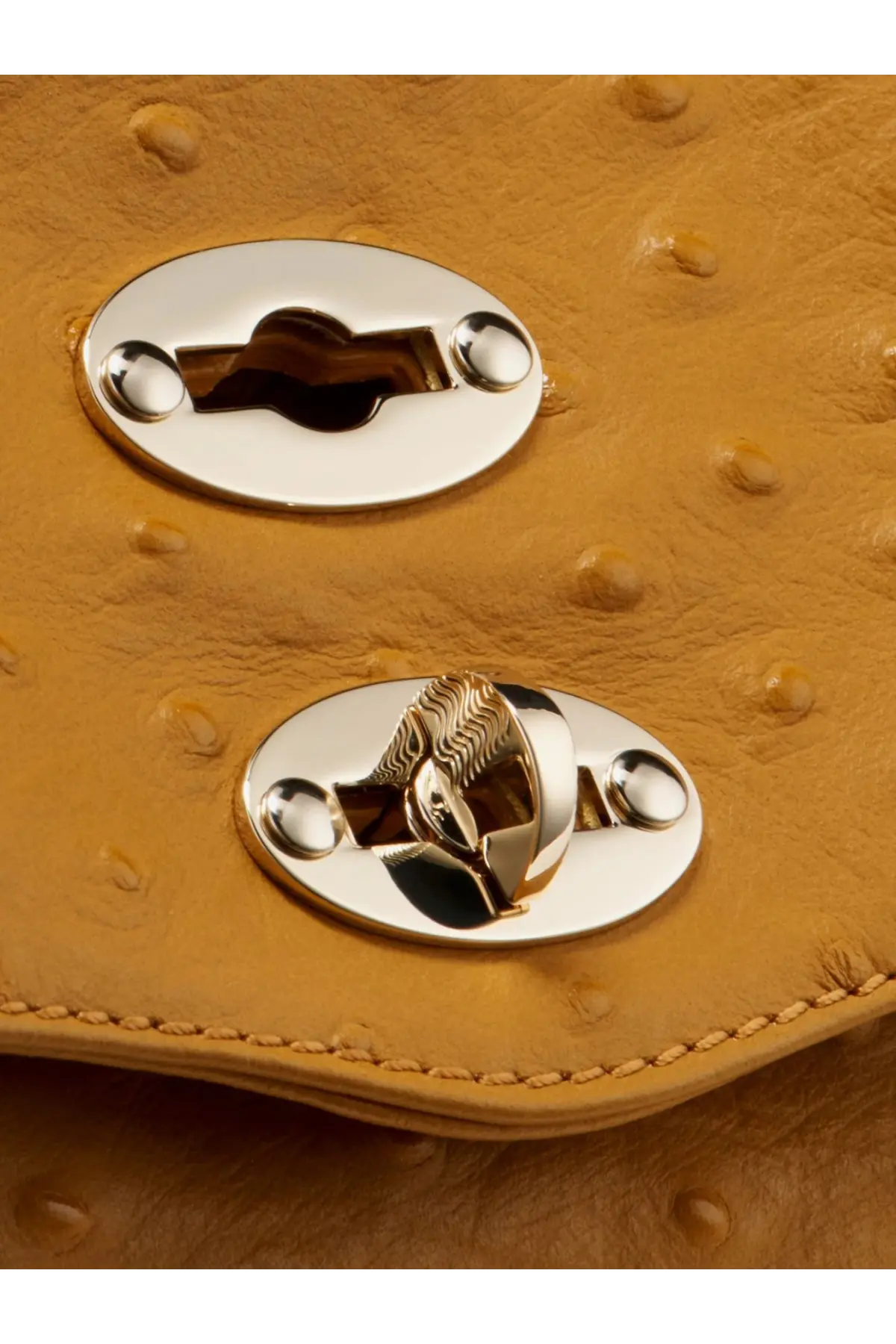Zanellato women’s postina cactus leather crossbody brown clutch in tan ostrich leather with silver oval clasps and textured lock