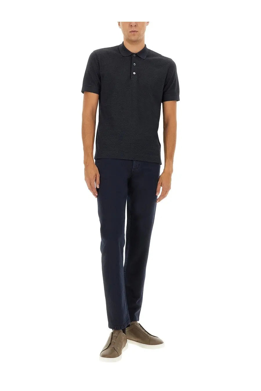 Black short-sleeved polo shirt with classic collar and white buttons shown with zegna men’s denim pants black