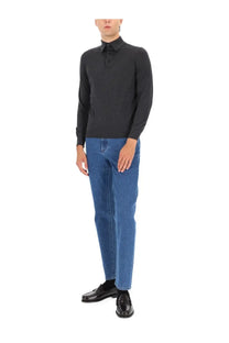 Black long-sleeved polo shirt with classic collar and buttoned front paired with zegna men’s jeans rocicia blue