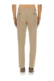 Beige zegna men’s premium cotton tailored trousers with a sleek straight-leg cut and subtle back pleats shown from the back