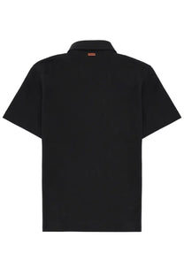 Black zegna men’s regular fit polo shirt with short sleeves and subtle orange tag at the collar