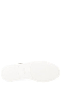 White rubber sole with silver tibi logo embossed on the back of zegna men’s grey sneaker