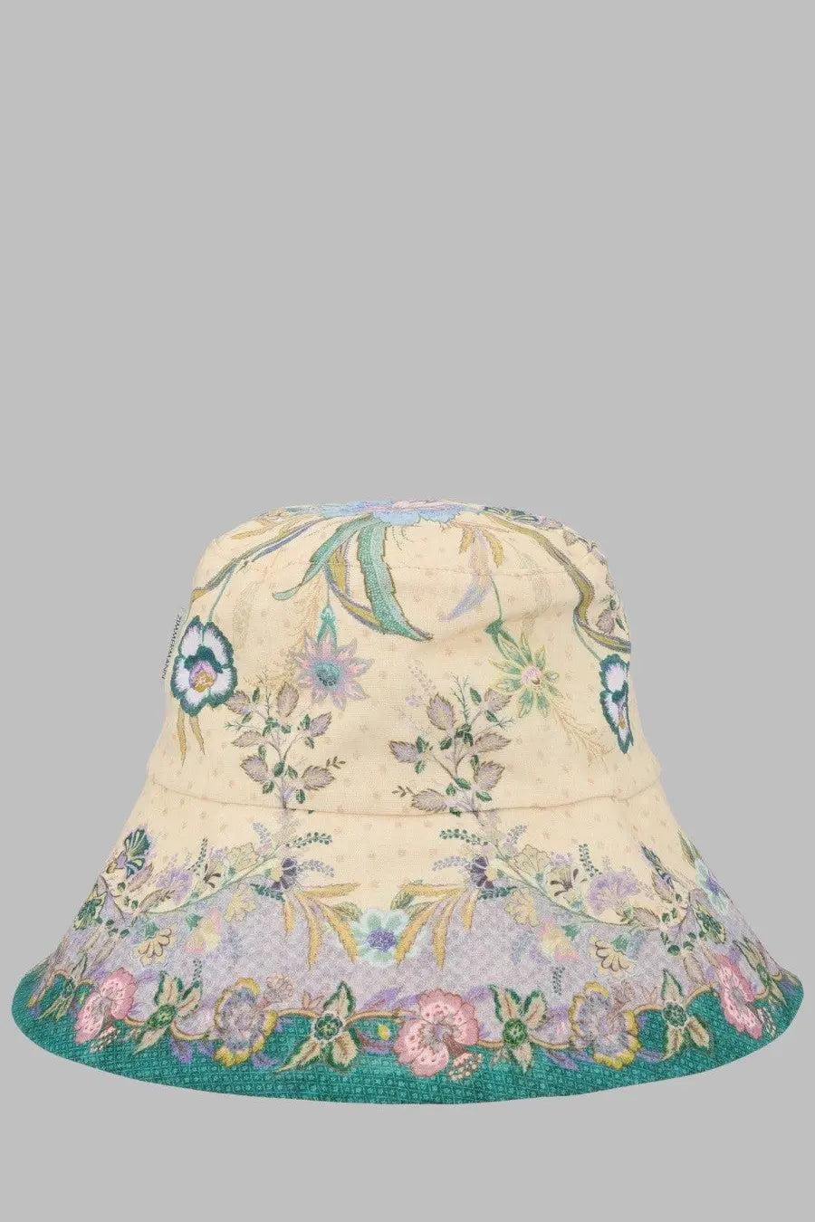 Zimmermann women’s cream bucket hat with pastel floral pattern and teal trim along the brim