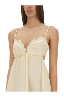 Zimmermann women’s cream-colored lace-trimmed camisole dress with floral embroidery and thin spaghetti straps