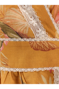 Zimmermann women’s frill cotton short dress in mustard yellow with floral pattern and white lace trim