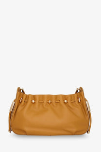 Tan leather shoulder bag with gold-tone hardware and drawstring closure for stylish daily use