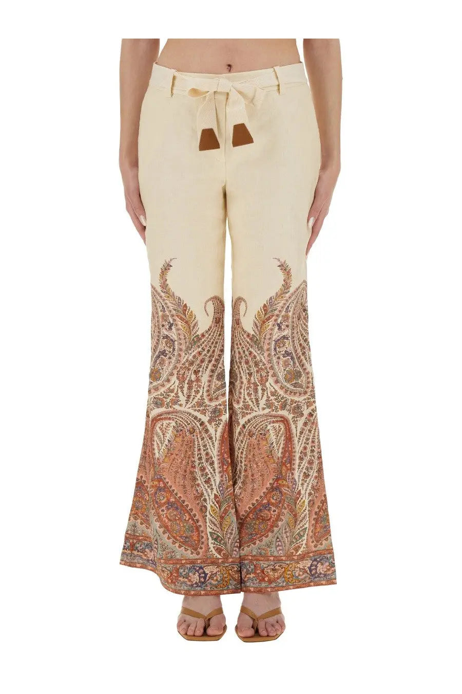 Zimmermann women’s cream-colored wide-leg pants with intricate paisley pattern tied waistband and brown leather accents