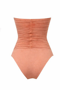 Zimmermann women’s one piece swimsuit in peach with ruched corset style back and smooth fabric shown from the back