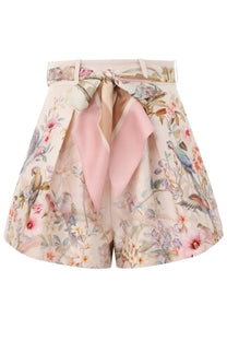Zimmermann women’s rebellion pleated shorts in pastel pink and beige floral with matching ribbon tie at the waist