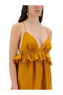 Zimmermann women’s Rhiannon dress gold is a mustard-yellow satin slip dress with delicate ruffled waist detailing