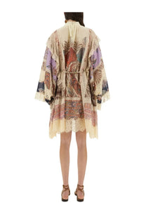 Zimmermann women’s Rhiannon mini dress is an off-white kimono style with paisley prints and lace trim in earthy tones