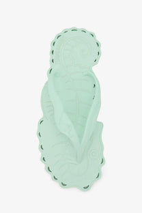 Zimmermann women’s seafoam thong rubber sandals displayed with a mint green silicone seahorse flip-flop mat