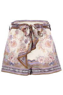 Zimmermann women’s high-waisted silk-like shorts with pastel floral and paisley pattern and brown edge accents